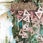 Detail image of Gregory Euclide's "Spangle." Hollow pyramids made by paper under a piece of foam colored in grey.