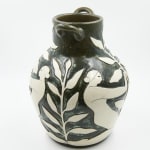 Hilda Palafox black vase sculpture with white women holding white leaves