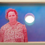 painting of a sad woman in pink over a blue background