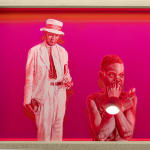 pink painting of a man standing and a boy in the foreground, legs beyond the frame of the painting