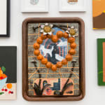 Gustav Hamilton "The fruit bowl at sugar island" multimedia piece of textured shapes in earth tones in a rounded brown frame