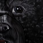 Detail photograph of the small black dog, focusing on its nose and eye by Sabrina Bockler