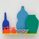 Sculpture of a yellow shelf with the silhouettes of a dark blue wine bottle, a light blue vase, a green vase, a striped white and black bowl and three tomatoes on the vine on a yellow shelf.