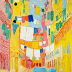 brightly colored alleyway with ropes of drying clothes tied across