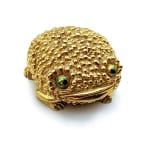 gold frog shaped compact with green eyes