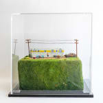 full view of artwork with glass case