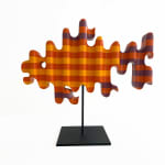 photo of a wooden sculpture in the shape of a goldfish by Casey Gray