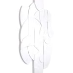 all white wooden relief piece featuring many smaller pieces side angle