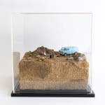 zoomed out view of artwork with glass case over it