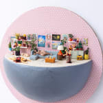 miniature diorama by Abigail Goldman of a woman laying on the couch next to a bloody man on the floor and severed body parts