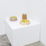 installation view of artist AP Shrewsbury's ceramic dog bowls on a pedestal, installed at Hashimoto Contemporary San Francisco
