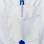 painting of a white shirt pocket with a blue pen bleeding through the shirt