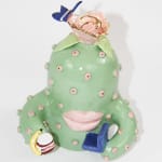 Jen Dwyer sculpture of green cactus with pink lips holding laptop, banana and Nutella jar