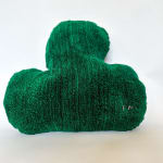 Soft sculpture of a dark green leaf