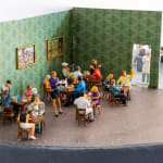 miniature diorama by Abigail Goldman of a restaurant with a human body being prepared in the kitchen s
