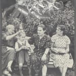 Greyscale collage, four women of varying ages sit on a bench in front of foliage