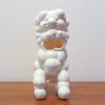 Carved white eggshells form a sitting open-mouthed dog sculpture which mimics the image of traditional Chinese lion dog guardians