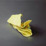 One crumpled yellow Post-it note with blue scribbles against dark gray background.