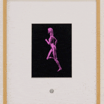 Moving image of wooden frame with white mat and black rectangle depicting pink running woman.