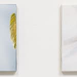Diptych of two abstract panels. Left panel has grainy light blue background with two thick, textured, yellow, vertical brushstrokes (one near the left of the canvas and the other at the right edge). Right panel has muted pastel pink and gray brushstrokes over white background.