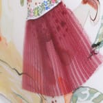A detailed image of a woman's pink floral dress in the painting.
