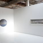 Installation view of Far North with Illuminations at Piedra Blanca on the right