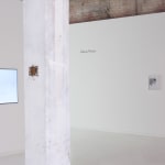 installation view of video with other artworks visible