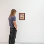 Man admires Untitled (Lean Mouth), installed