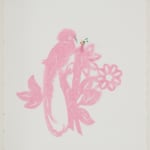 A pattern of a quetzal perched on top of a floral tree branch cut out of pink tissue paper. The pink tissue paper pattern is mounted on a white piece of paper. On top of the papers a tiny human figurine kneels down and appears to be feeding the pink quetzal strips of green tissue paper