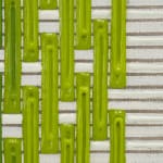 Detail; dark and light green columns painted over horizontal beige and white stripes.
