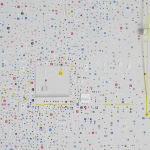 Detail; thousands of white, blue, red, and yellow 1D and 3D cutouts on a white background.