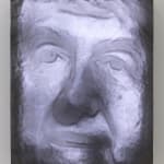 Still image of multiple white LEDs behind carved resin which forms a self portrait of the artist The LEDs illuminate the structure to highlight its positive spaces