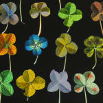 Detail of several colorful patterned clovers.