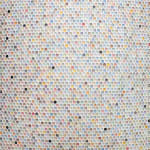bubble wrap indents cast into plaster and painted in various pastel colors with a few ones done randomly in black