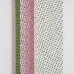 Side view of a green, pink, and white abstract painting mimicking fabric.