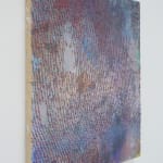Side view of a multicolored abstract painting.