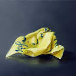 One crumpled yellow Post-it note with blue cursive writing against dark gray background.