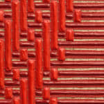Detail of the red left panel showcasing the multiple layered of paint and textured patterning