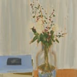 Flowers in vase to the right of three stacked books on orange surface in front of beige wall.