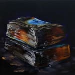 Two thick stacked books burned to a glowing charred state against a black background. The top book features the remnants of a burned blue cover.