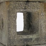 Detail of stone lantern with stylized details.