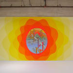 Installation view; an elliptical painting is set within a painted, wavy, radiating, ombre frame.