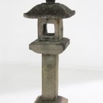 Tall stone lantern with stylized details.