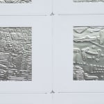 Detail; 2 rectangular foil slides, each with unique raised linear designs, in white mounts.
