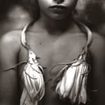 Night blooming cereus around Jessie's neck, from the Immediate Family series, by Sally Mann