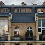 Gail Albert Halaban Out My Window Paris Bis rue de douai, Paris, 9e, le 21 mai, man woman man on phone in windows building with balcony architecture