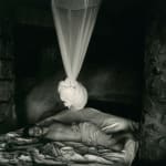 Sally Mann Immediate Family series, Sheet Changing Day, Emmett lying on bed with white bed canopy tied up above him