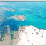 View of beach and sea at Scala dei Turchi by Massimo Vitali