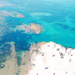 View of beach and sea at Scala dei Turchi by Massimo Vitali