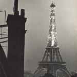 Ilse Bing photograph of Eiffel Tower illuminated at night in Paris